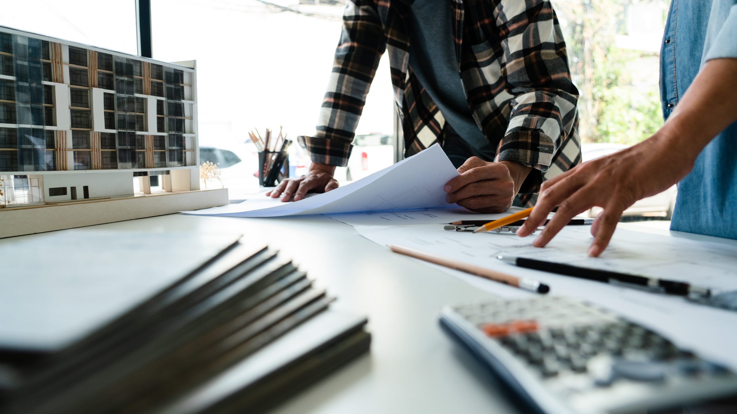 Two engineer working to discuss and brainstorming about blueprin